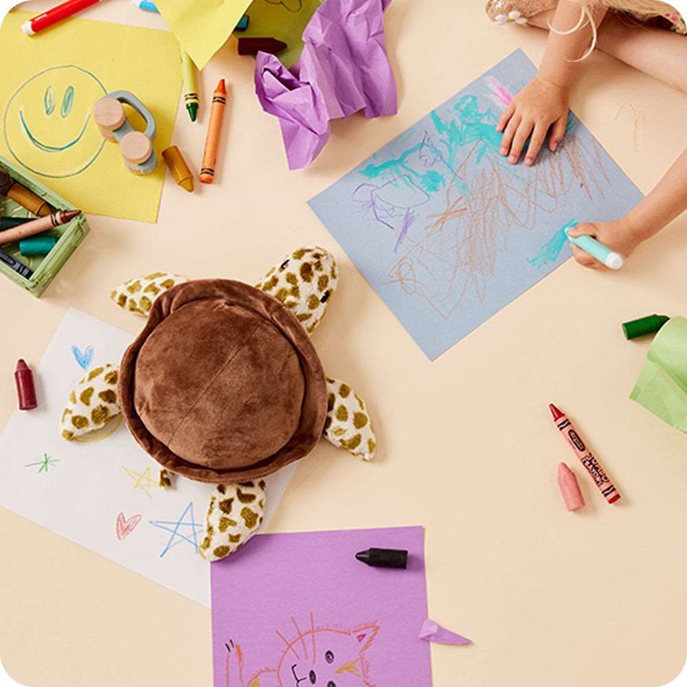sea turtle stuffed animal on kids coloring table