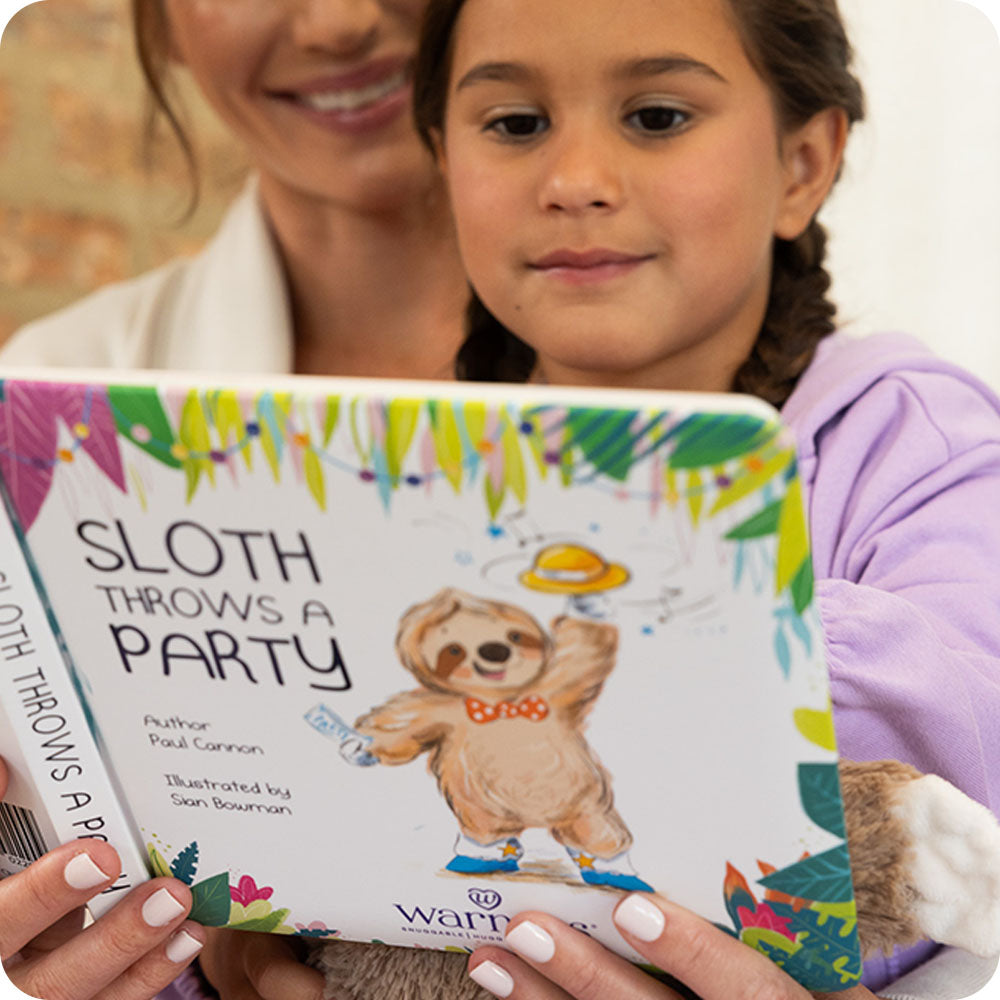 girl and her mom reading Warmies Sloth Throws a Party book