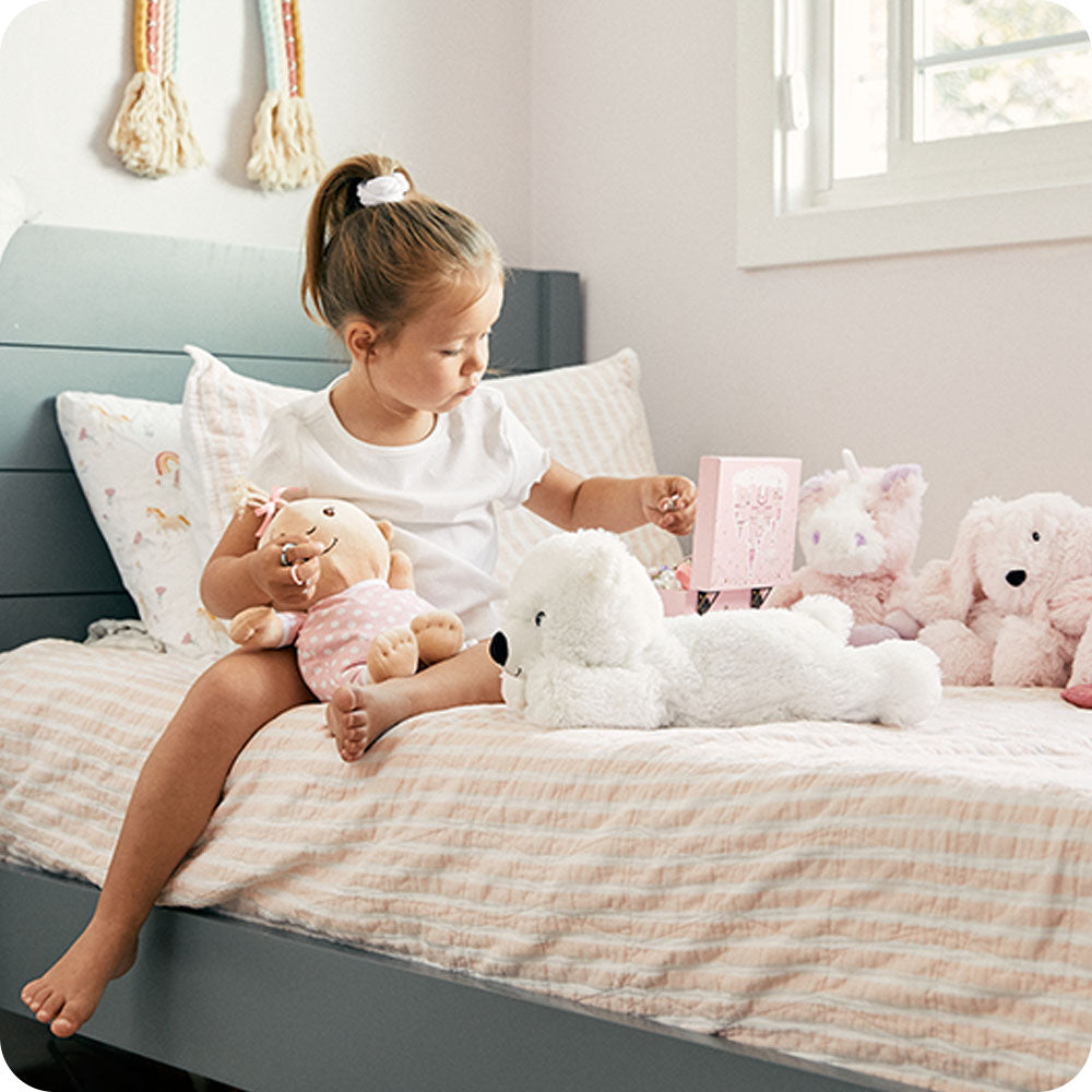 white bear warmies on bed lifestyle