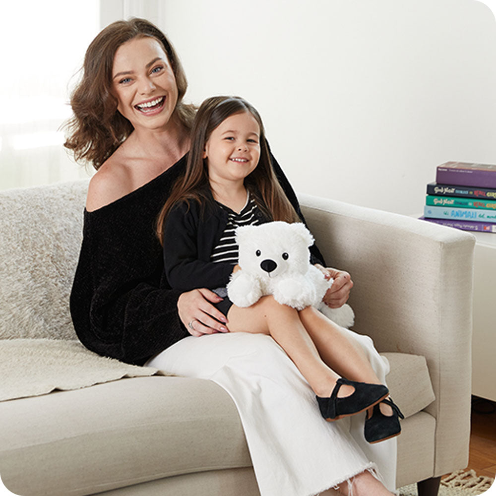white bear warmies on lap lifestyle